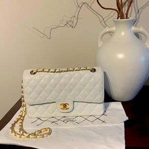 Chanel white leather bag ( gift) not sure has all stamps and all some no issues